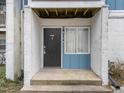 Condo entrance with dark door and light blue trim at 7002 Longstreet Dr # C, Raleigh, NC 27615