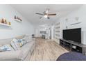 Open concept living room and kitchen with wood-look floors at 7002 Longstreet Dr # C, Raleigh, NC 27615