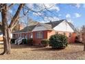 Side view of brick ranch house with landscaping at 809 Jeffreys Rd, Rocky Mount, NC 27804