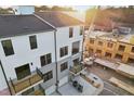 Rear exterior of townhome featuring balconies and backyard patios under construction at 109 Ailey Brook Way # 200, Wake Forest, NC 27587