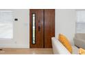 Interior view of a modern wood front door with black accents at 1128 E Geer St, Durham, NC 27704