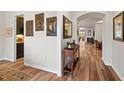 Bright and airy entry hall with hardwood floors and a view into the living room at 1501 Lincoln Mill Dr, Durham, NC 27703