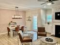 Modern dining room with concrete table, and stylish pendant lighting at 166 Gulley Glen Dr, Garner, NC 27529