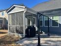 Screened porch with a patio and pergola, great for outdoor entertaining at 1751 Flint Valley Ln, Apex, NC 27502