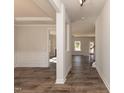 Inviting foyer featuring hardwood floors, neutral walls, and elegant trim work leading into other rooms at 237 Hopewell Branch Ct, Smithfield, NC 27577