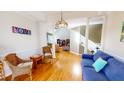 Bright dining room with hardwood floors and view to living room at 2440 Helena Moriah Rd, Timberlake, NC 27583