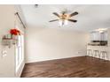 Open living area with modern flooring flows into the kitchen, enhanced by bright light at 30 Cheltenham Dr, Clayton, NC 27520