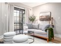Spacious living area with comfy seating and access to a balcony at 3805 Chimney Ridge Pl # 008, Durham, NC 27713