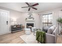 Living room features hardwood floors, fireplace, and plenty of natural light at 3805 Chimney Ridge Pl # 008, Durham, NC 27713
