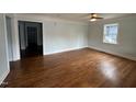 Spacious living room featuring hardwood floors and light blue walls at 401 Commonwealth St St, Durham, NC 27703