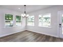 Bright dining room with hardwood floors and large windows at 515 Wendover Pkwy, Pittsboro, NC 27312