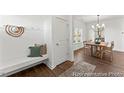 Bright entryway with built-in bench, coat hooks, and view into dining area at 292 Nathan Dr # 46P, Lillington, NC 27546