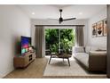 Comfortable living room with a sectional sofa and a large flat-screen TV at 711 E Lenoir St # 207, Raleigh, NC 27601