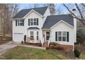 Two-story house with attached garage and brick accents at 1006 Silent Retreat Ln, Knightdale, NC 27545