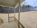 Overlooking a natural, wooded landscape this back porch is the perfect place to relax at 1116 Prominence Dr., Homesite 31, Durham, NC 27712