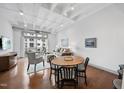 Bright living area with hardwood floors, dining table, and balcony access, perfect for relaxing at 1300 St Marys St # 403, Raleigh, NC 27605