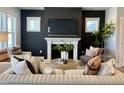 Comfortable living room showcases a cozy fireplace, modern furniture, and natural light at 1364 Barreto Dr, Wendell, NC 27591