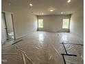 Spacious bedroom featuring large windows, offering natural light and a calming atmosphere at 14 E American Marigold Dr # 65, Benson, NC 27504