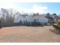 Side view of the house showing landscaping and yard at 216 Parrish Farm Lane Ln, Benson, NC 27504