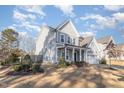 Gray two story house with white trim and landscaping at 2801 Raddercrest Ct, Fuquay Varina, NC 27526