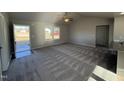Spacious living room with carpeted floors and high ceilings at 90 Faucette Dr, Selma, NC 27576