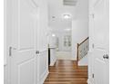 Bright entryway with hardwood floors, leading to living area and staircase at 1014 Brightskies St, Morrisville, NC 27560