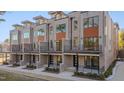 Modern townhomes with multiple units and private balconies at 1018 Manor Way, Durham, NC 27701