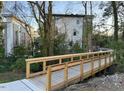 Wooden footbridge with metal railings providing access to the community at 1018 Manor Way, Durham, NC 27701