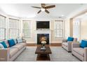 Inviting living room featuring a fireplace, hardwood floors, and neutral decor with bright accents at 10511 Sablewood Dr # 110, Raleigh, NC 27617