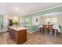 Open concept kitchen and dining area with hardwood floors at 112 Wagon Trl, Willow Springs, NC 27592