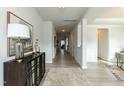 Bright and spacious entryway with hardwood floors and a console table at 117 Sunburst Ct, Fuquay Varina, NC 27526