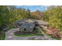 Luxury home with circular driveway and mature trees at 12044 Iredell, Chapel Hill, NC 27517