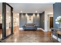 Bright entryway with hardwood floors and statement art at 12044 Iredell, Chapel Hill, NC 27517