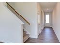 Staircase with carpeted steps and wooden handrail at 121 Barn Door Dr, Lillington, NC 27546