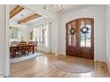 Bright and spacious entryway with hardwood floors and a view into the dining area at 1505 Montvale Grant Way, Cary, NC 27519