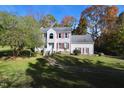 Two-story house with a landscaped lawn and walkway at 1524 Wedgewood Dr, Graham, NC 27253