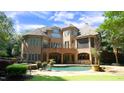 Brick home with pool and expansive patio at 15508 Possum Track Rd, Raleigh, NC 27614