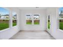 Inviting sunroom with large windows offering panoramic views of the backyard at 1705 Clydner Dr, Cary, NC 27523