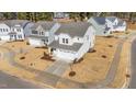 An aerial view of a charming two-story house in a residential neighborhood at 20 Windflower Ct, Clayton, NC 27520