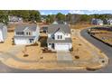 An aerial view of a charming two-story house in a residential neighborhood at 20 Windflower Ct, Clayton, NC 27520