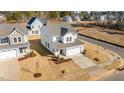 Two-story house viewed from above, showcasing the home's curb appeal and neighborhood at 20 Windflower Ct, Clayton, NC 27520