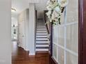 Bright and airy entryway with hardwood floors and staircase at 222 Kylemore Cir, Cary, NC 27513