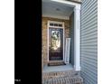 Welcoming front entrance with brick steps and a wreath at 222 Kylemore Cir, Cary, NC 27513