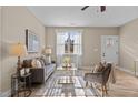 Living room features large windows and stylish decor at 316 Jasmine Rd, Fuquay Varina, NC 27526