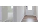 Bright entryway with hardwood floors and views into the living areas at 37 Baird Cv Ln, Angier, NC 27501