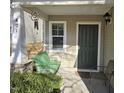 Front porch with a green bench, providing a welcoming entrance at 401 Ganyard Farm Way, Durham, NC 27703