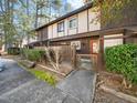 Exterior view of a townhouse with a wooden fence and landscaping at 4236 Lake Ridge Dr, Raleigh, NC 27604