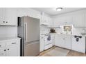 Modern kitchen featuring stainless steel appliances and white cabinetry at 6910 Saxby Ct, Raleigh, NC 27613