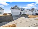 This home boasts a welcoming front porch and a two-car garage at 83 Winding Creek Dr, Lillington, NC 27546