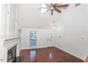 Bright living room with hardwood floors and a fireplace at 1003 Pagoda Pl, Knightdale, NC 27545